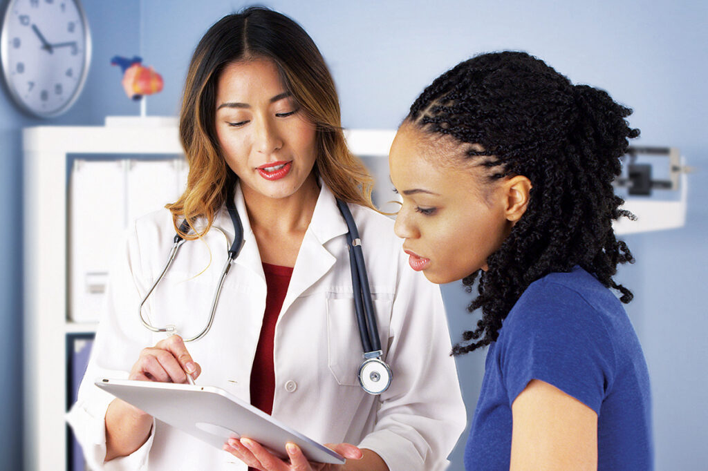 A doctor explaining the chart information to the patient.